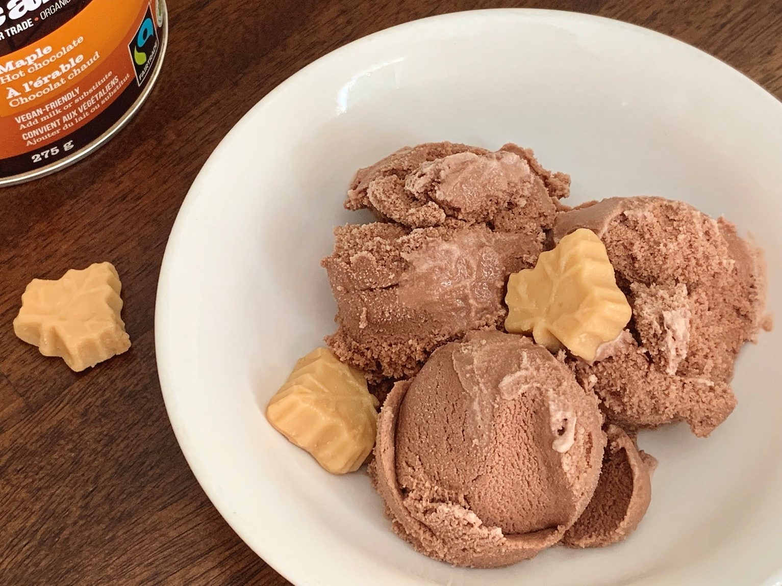 Scoops of chocolate ice cream decorated with sugar maple leaves